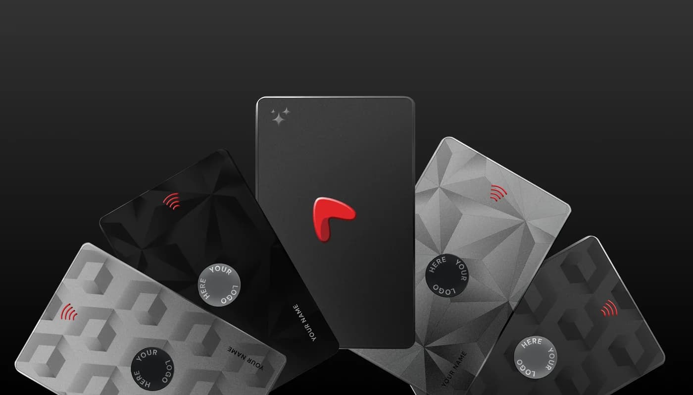 Signature NFC cards fanned in an arc, each showing where your name and logo go, with the Linkist mark on the card in the middle